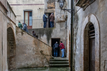 Foreign visitors inspect the buildings in Sambuca di Sicilia with a view to buying one for €1.