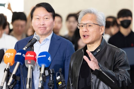 Jensen Huang, right, CEO of Nvidia, speaks alongside Chey Tae-won, left, chairman of SK Group, during a media briefing on AI and semiconductor cooperation between NVIDIA and SK Group.