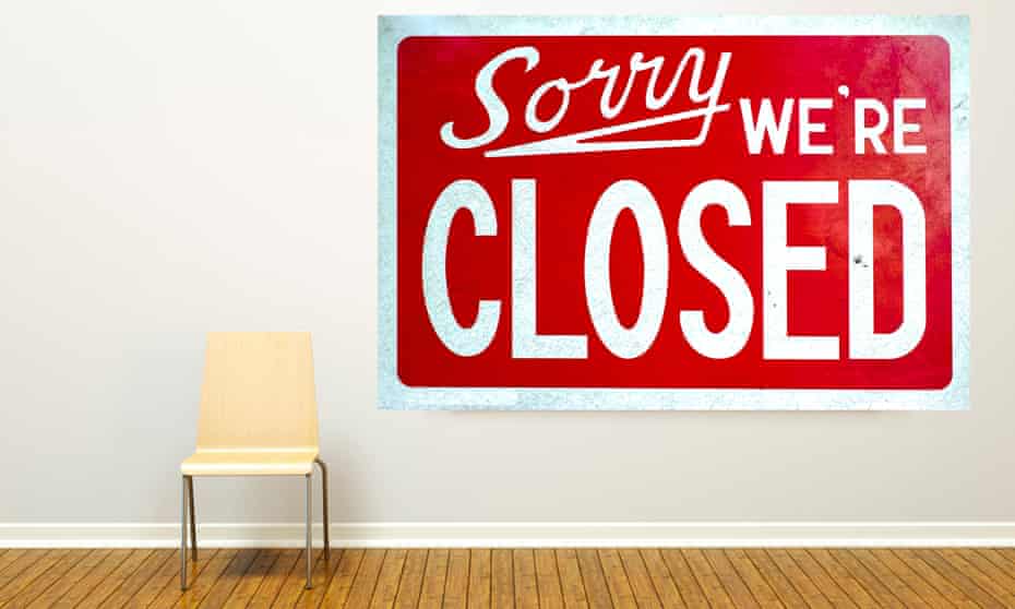 A frame hanging in an art gallery with a 'Sorry, We Are Closed Sign' inside