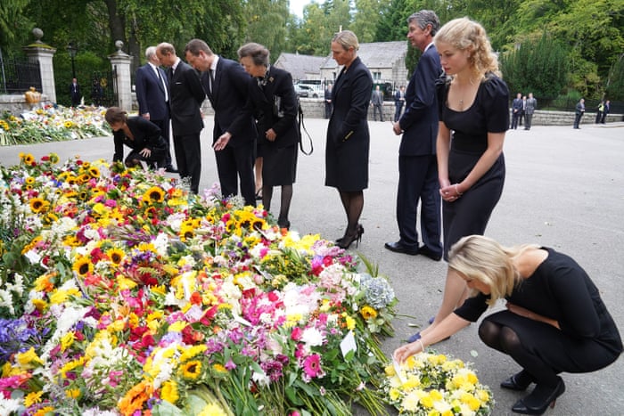 (Left to right) Princess Eugenie, the Earl of Wessex, Peter Phillips, Princess Anne, Zara Tindall, Vice Admiral Timothy Laurence, Lady Louise Windsor and the Countess of Wessex view flowers.