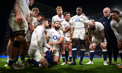 George Ford talks to his teammates after defeat against France