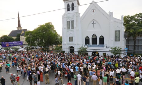 Hundreds of people stream from a public memorial, community prayer and healing vigil at the College of Charleston for those killed at the Mother Emanuel AME church on Friday.