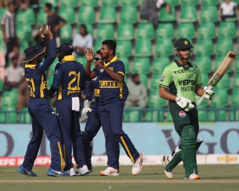 The Sri Lanka players celebrate after Dilshan Madushanka claims the wicket of PakistanâÂÂs Arafat Minhas in Lahore
