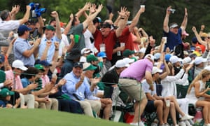 Patrons celebrate Tiger Woods’s putt for birdie at the 16th hole in the final round of the Masters in 2019.