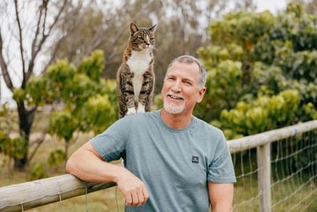 Owner Robert Dollwet with Didga the cat sitting on his shoulder