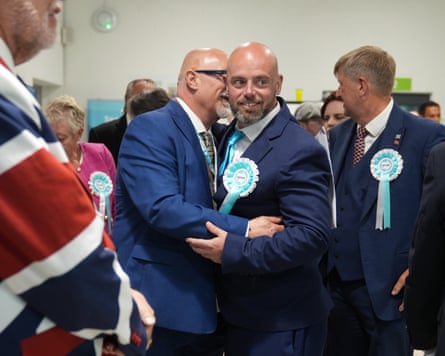 People wearing Reform rosettes celebrate