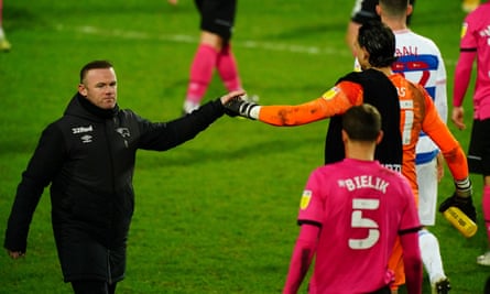 Wayne Rooney celebrates Derby’s win at QPR in January with his goalkeeper Kelle Roos.