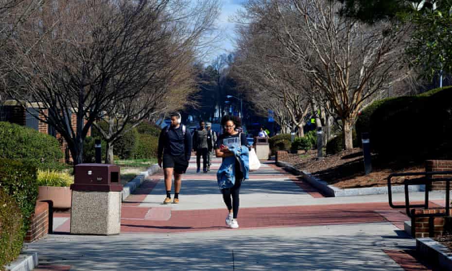Students walk at North Carolina A&amp;T University along the line that divided congressional districts 13 and six on campus in Greensboro, North Carolina, in 2019.