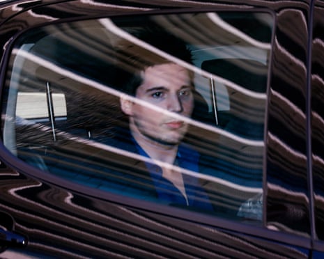 Rui Pinto (L) arrives to Lisbon Criminal Court in March 2019 in the back of black car.