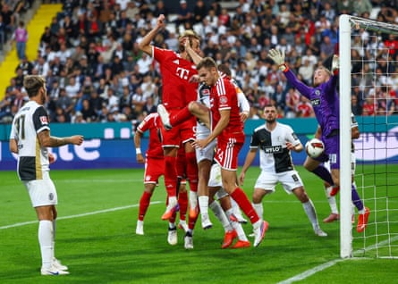 Nicolas Kristof makes himself big for Elversberg to deny Harry Kane.