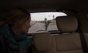 A woman looks on as Mous whips past