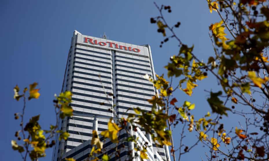 The Rio Tinto office building in Perth, seen through the branches of a tree