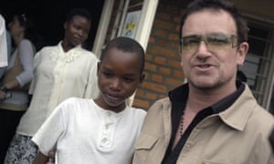 Bono with a young patient at a health centre in Rwanda in 2006.