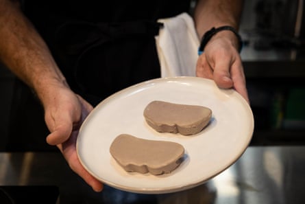 Two slices of foie gras on a plate