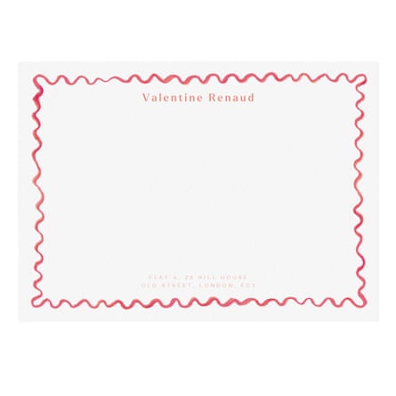 White card with a name on a top and a squiggly border