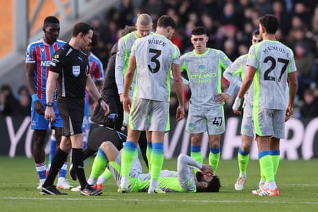 Josko Gvardiol is checked on by teammates after sustaining an injury
