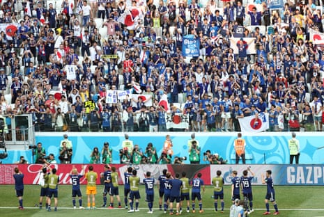 Japan players applaud their fans after the match.