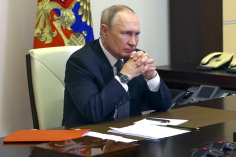 Russian President Vladimir Putin chairs a security council meeting via videoconference.