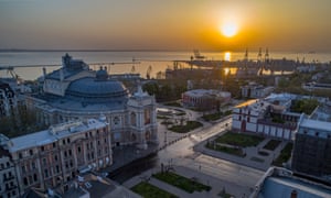 Aerial image of sunrise over the Odessa Opera House Ukraine. The port of Odessa is in the background