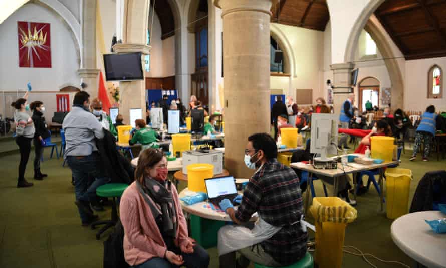 Booster jabs being administered at St John’s Church in west London on 4 December 2021.