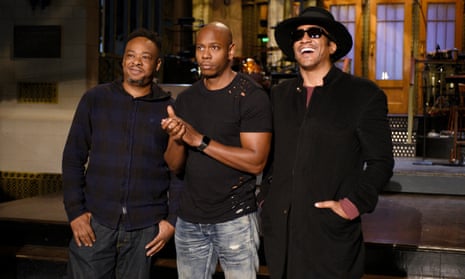 Jarobi White and Q-Tip of musical guest A Tribe Called Quest pose with host Dave Chappelle on Saturday Night Live