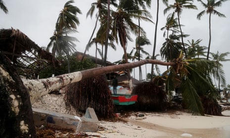 A man stands amidst debris on the seashore in the aftermath of Hurricane Fiona in Punta Cana, Dominican Republic, on Monday.