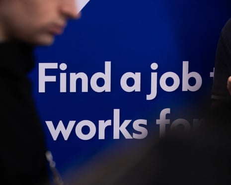 A blue sign reads "Find a job that works for" with partial faces visible in foreground