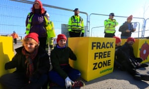 Campaigners block the entrance to the Preston New Road fracking site in Lancashire, after the government overruled the local council decision to reject planning permission.