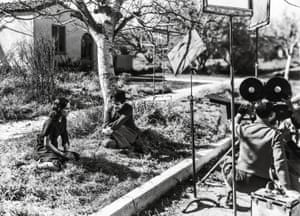 Paulette Goddard and Chaplin filming Modern Times. The film was partly inspired by a conversation between Chaplin and Mahatma Gandhi in which they discussed modern technology.