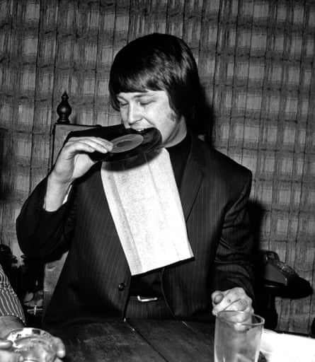 Brian Wilson of the Beach Boys in Los Angeles, in 1968, biting on a record