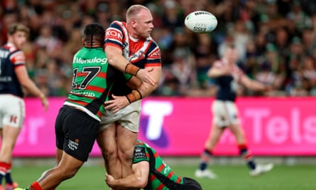Matthew Lodge of the Roosters offloads the ball in the recent meeting with the Rabbitohs.