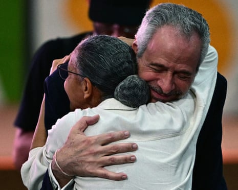 Cop30 president André Corrêa do Lago hugs Brazil's environment minister Marina Silva after her speech at the Climate Change Conference
