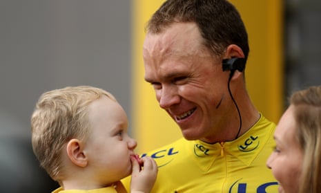 Chris Froome holds his son Kellan as he celebrates his fourth Tour de France victory in Paris. He said his immediate plan was to move on to the Tour of Spain.