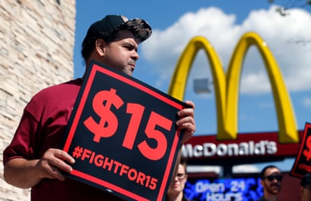 Supporters of a $15 minimum wage for fast food workers rally in front of a McDonald’s in Albany, New York State.