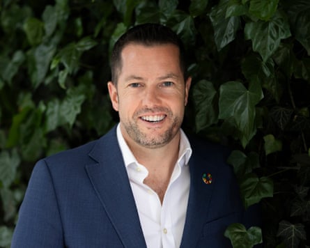 A man in a navy suit