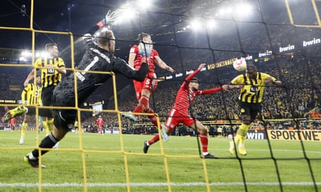 Modeste’s late header earns Dortmund dramatic draw with 10-man Bayern