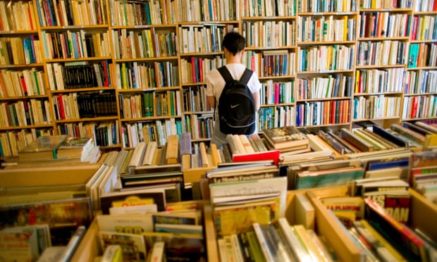 Browsing in one of the town’s secondhand bookshops. Fontenoy-la-Joûte, France.