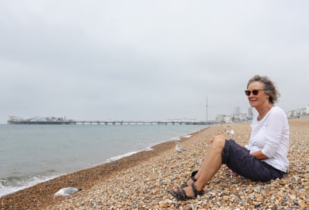 Jo Armstrong sits on the pebbles on Brighton beach
