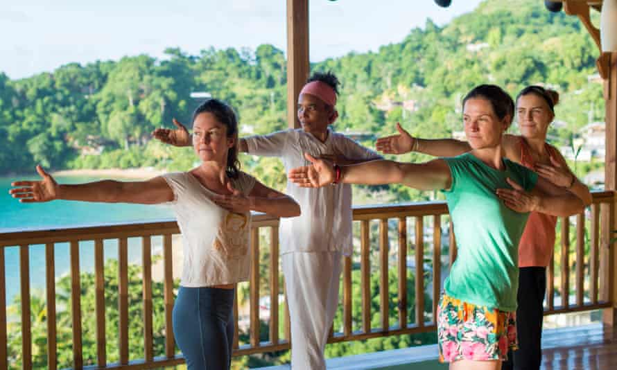 Jane Dunford (left) joins a yoga class at Castara Retreats.