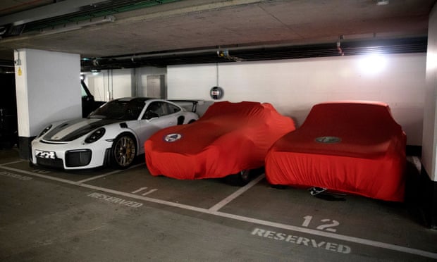 A collection of sports cars in the parking garage at the Vista development, to which the Payments have no access.