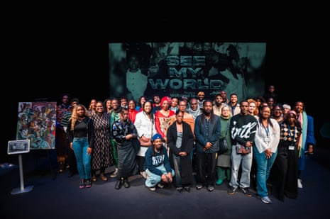 People gather in front of a poster that reads ‘See my world’
