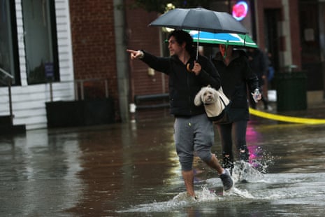 Heavy rain causes flooding in New York regionA man carries a dog in a bag as he walks through heavy flooding in the New York City suburb of Mamaroneck, New York, U.S., September 29, 2023.