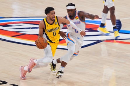 Pacers guard Tyrese Haliburton drives past Thunder guard Luguentz Dort on Monday night during the second half of Game 5 of the NBA finals in Oklahoma City.
