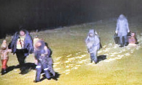 A screengrab from an RCMP video shows people crossing the Manitoba border into Canada.