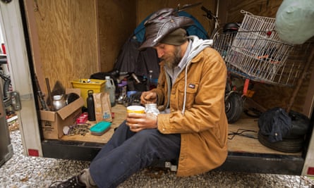Alex Dezanett lives in a tent pitched in a horse trailer in Beattyville.