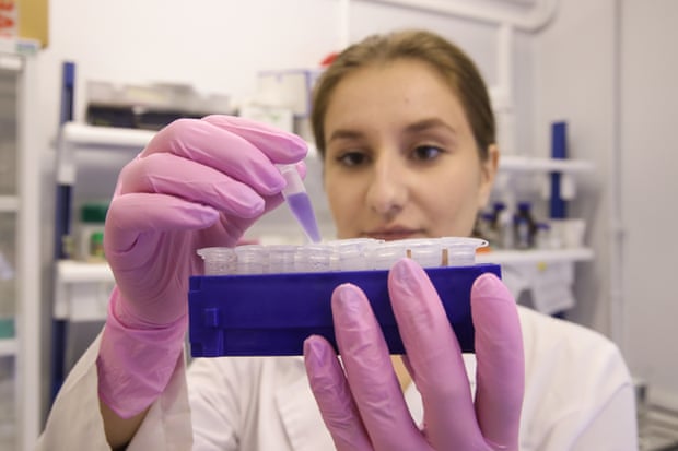 an employee at work at the gamaleya scientific research institute of epidemiology and microbiology in moscow.