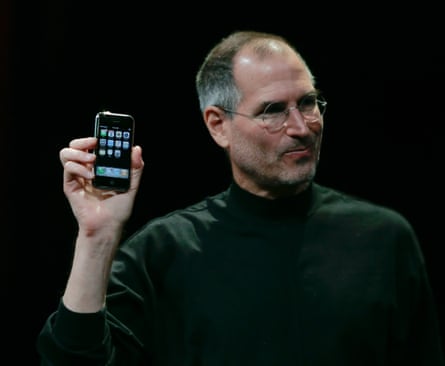 Head and shoulders shot of Apple executive officer Steve Jobs holding the first iPhone in San Francisco, California, 2007