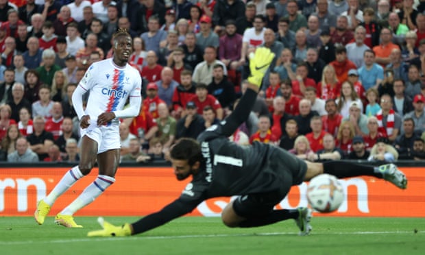 Wilfried Zaha fires the ball past Alisson Becker to put Crystal Palace ahead