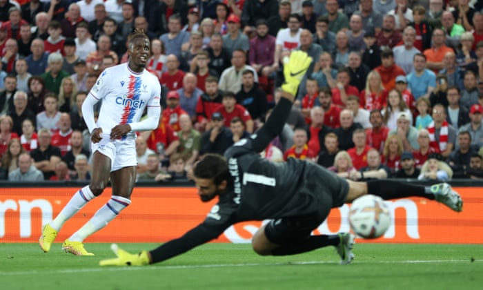 Liverpool v Crystal Palace: Premier League – live! | Premier League 3 Wilfried Zaha of Crystal Palace scores their first goal past Alisson Becker of Liverpool.