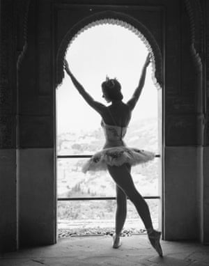 Ballerina Margot Fonteyn stands at a window in Granda, Spain